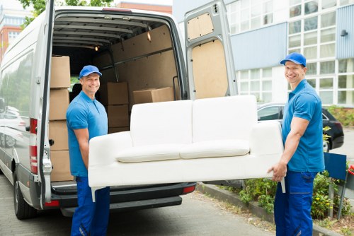 Experienced removal staff managing furniture