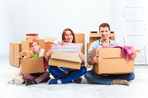 Professional movers assisting with a household move in Earls Court