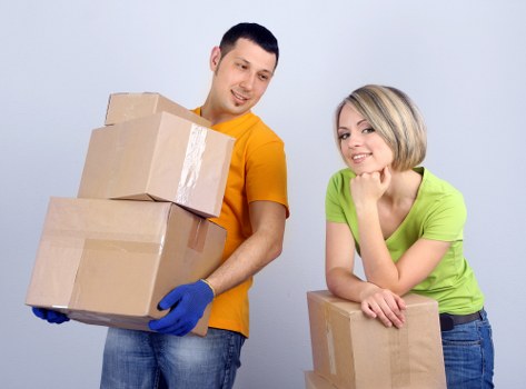 Professional movers loading a moving van