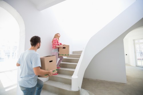 Movers disassembling furniture