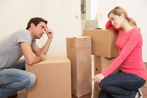 Professional movers handling furniture in Redbridge