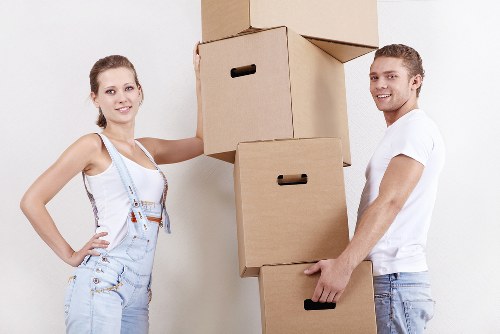 Skilled movers handling heavy furniture.