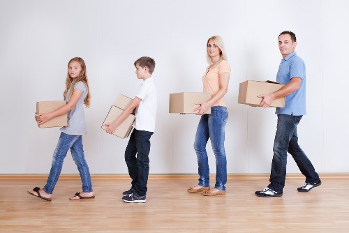 Team of movers loading furniture onto a truck