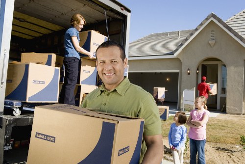 Professional movers handling household items