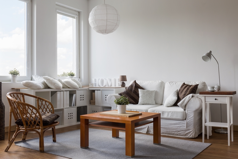 Removalists handling boxes in a Walthamstow home
